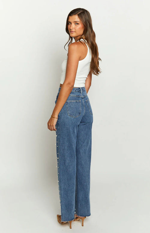 Jean droit à taille asymétrique, perles et ourlet effiloché